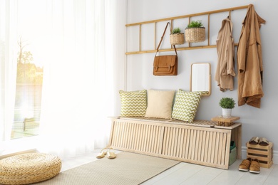 Photo of Cozy hallway interior with new stylish furniture