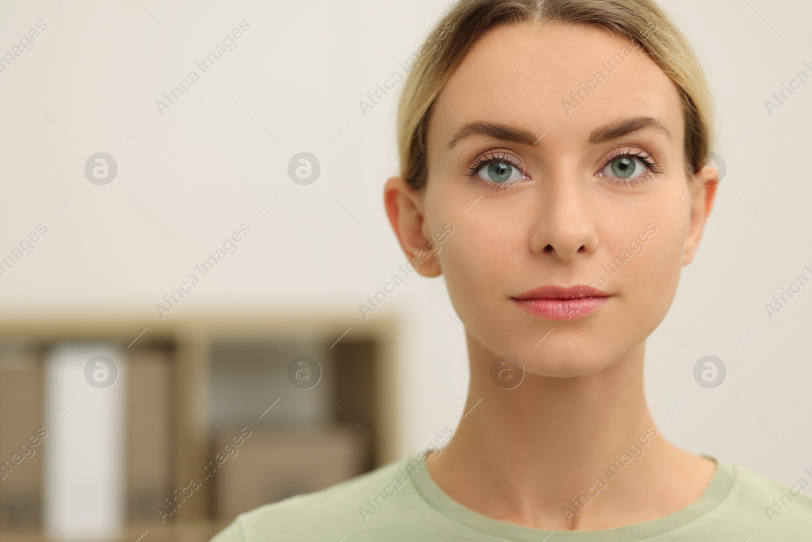 Photo of Portrait of beautiful woman indoors, space for text