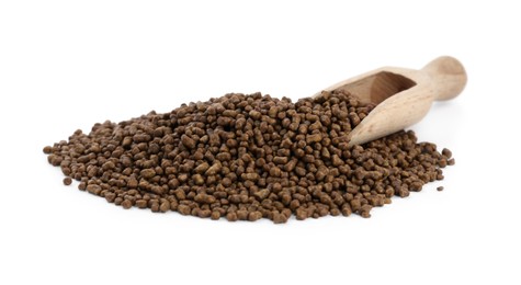 Buckwheat tea granules and wooden scoop on white background