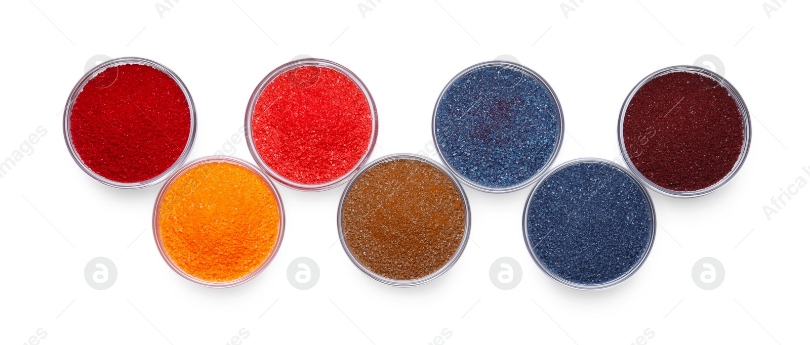 Photo of Glass bowls with different food coloring isolated on white, top view