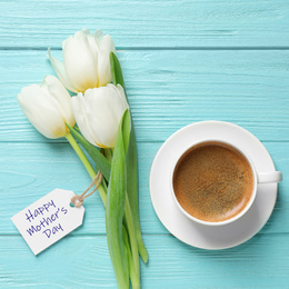 Image of Tag with phrase HAPPY MOTHER'S DAY, tulips and cup of coffee on light blue wooden background, flat lay