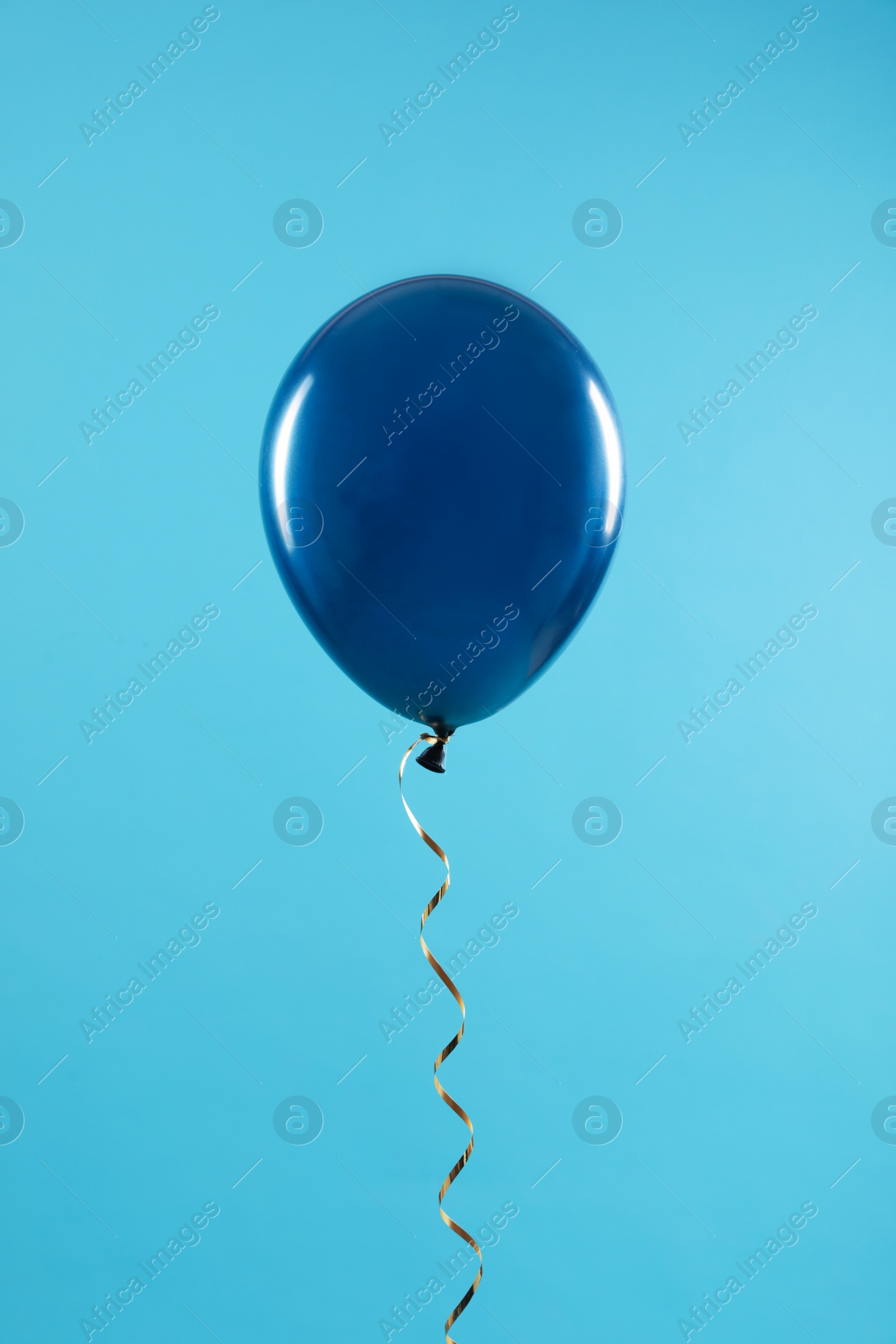 Photo of Bright balloon on color background. Celebration time