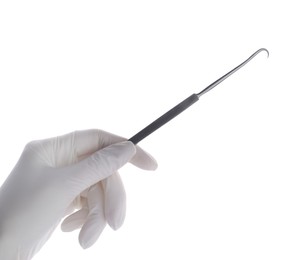 Photo of Doctor holding surgical hook on white background, closeup