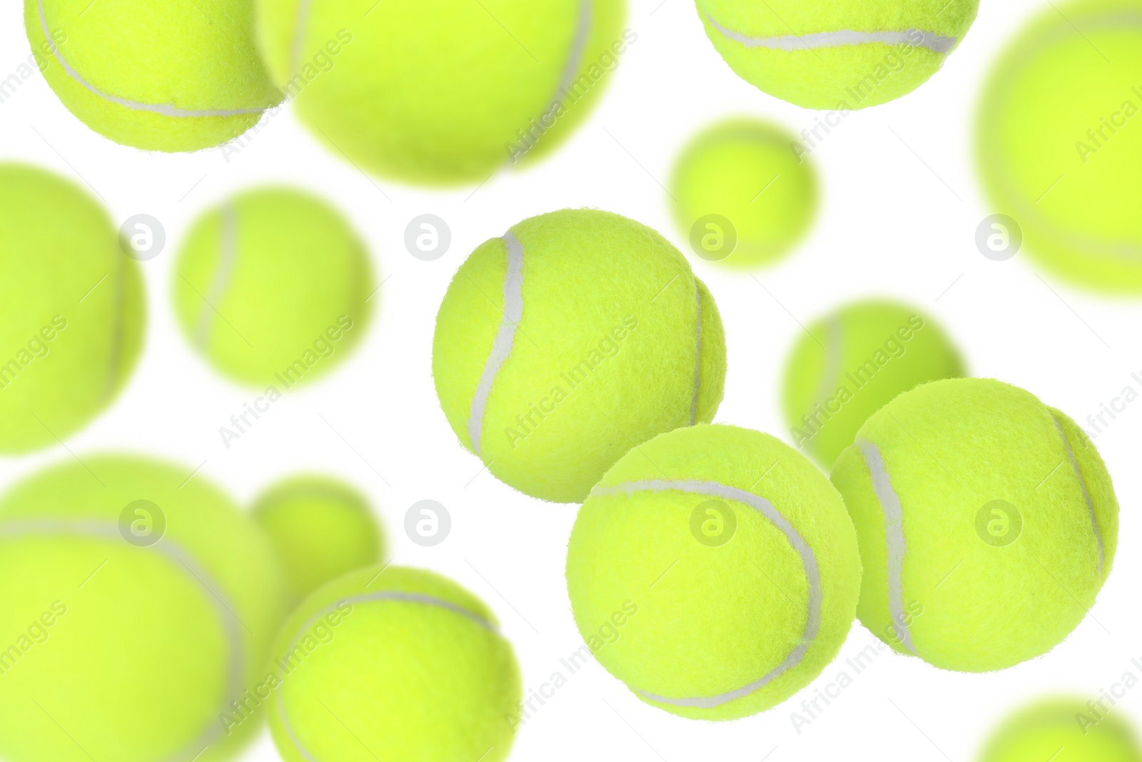 Image of Many tennis balls flying on white background