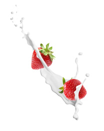 Fresh strawberries with milk splash on white background