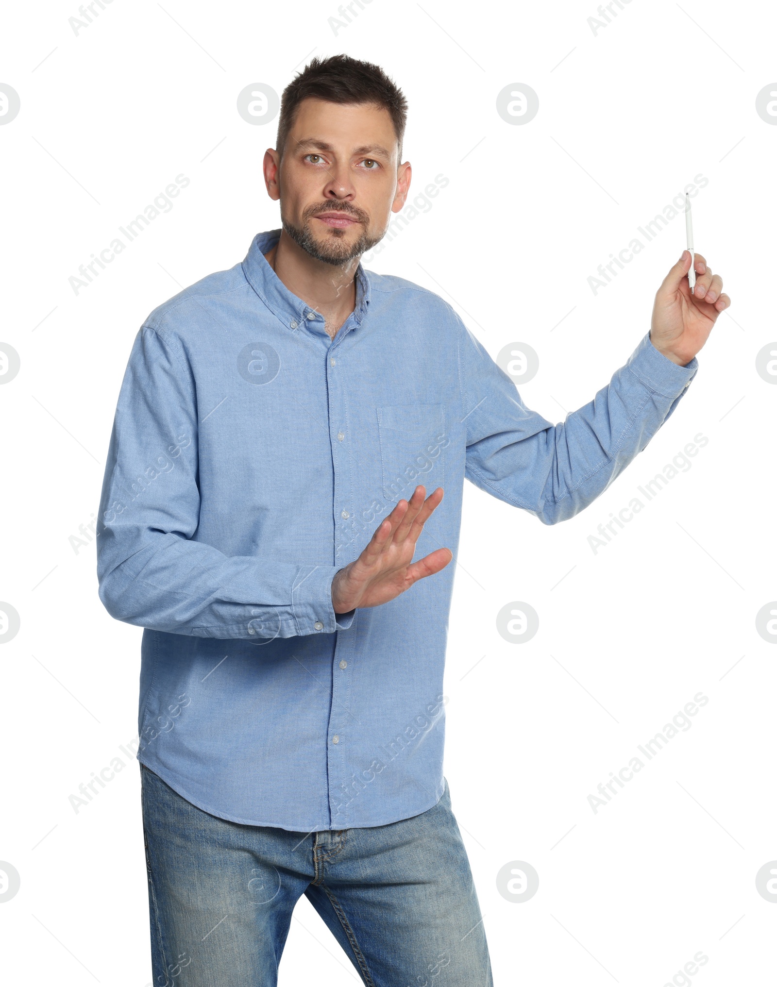 Photo of Handsome man pointing at something with pen on white background. Weather forecast reporter