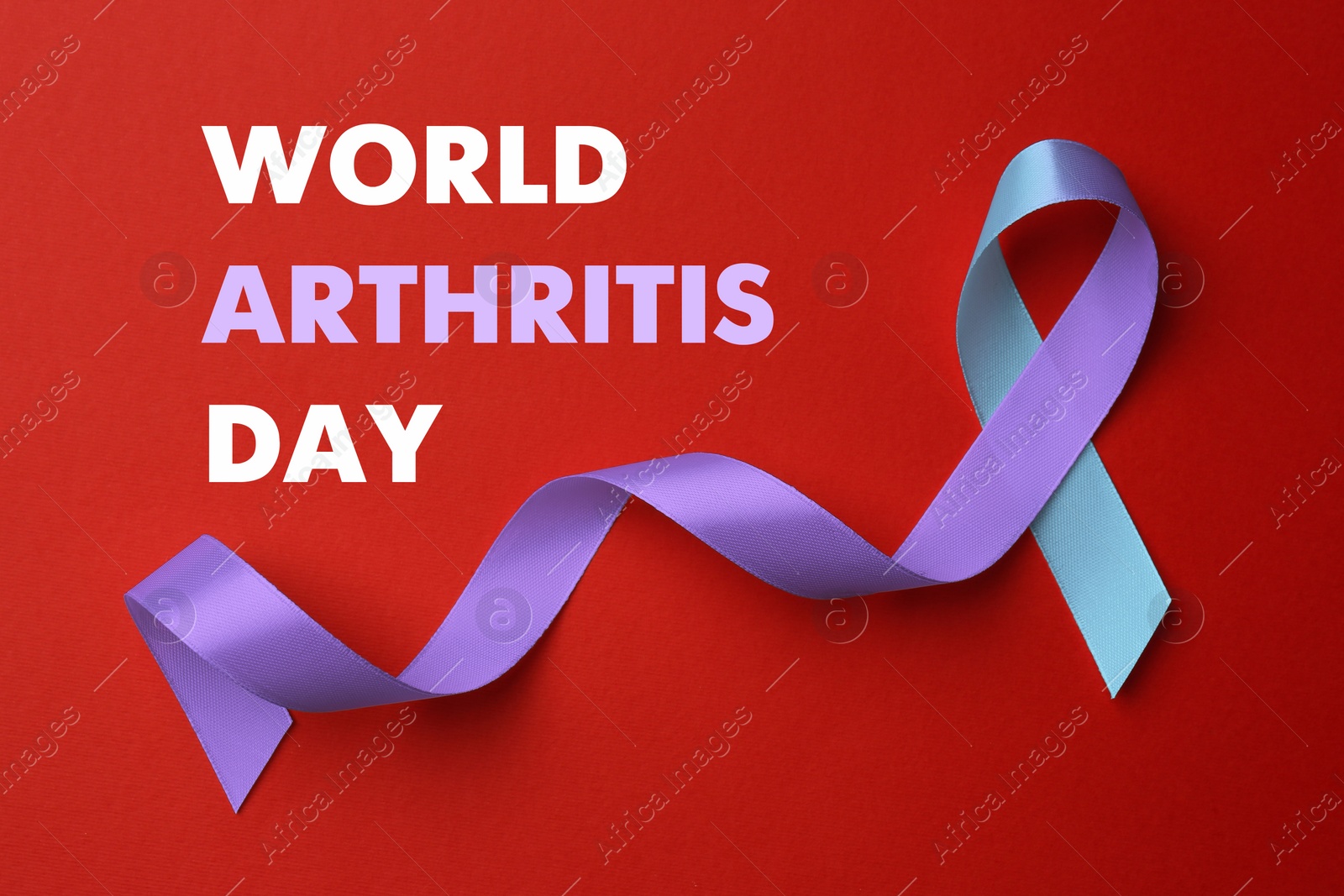 Image of World Arthritis Day. Blue and purple awareness ribbon on red background, top view