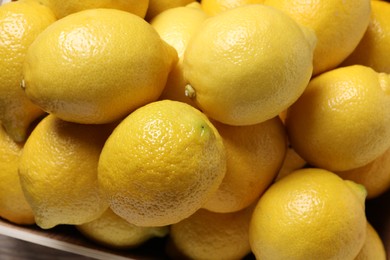 Fresh lemons in crate, closeup. Citrus fruit