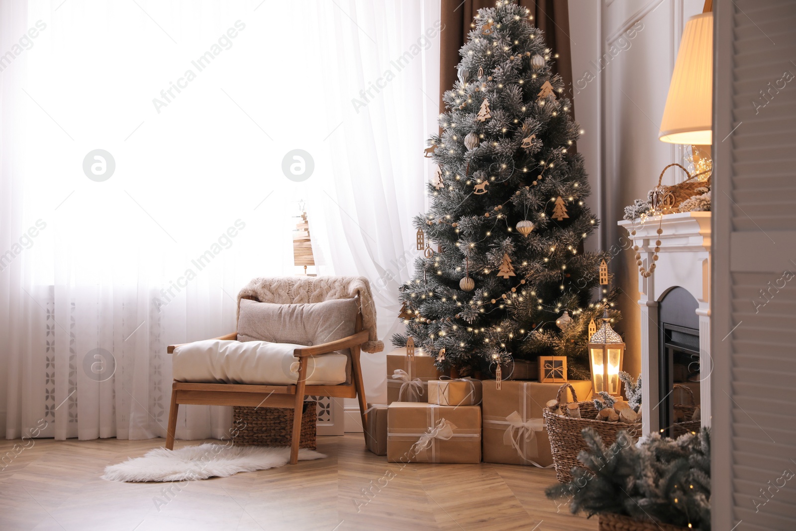 Photo of Beautiful living room interior with decorated Christmas tree and gifts