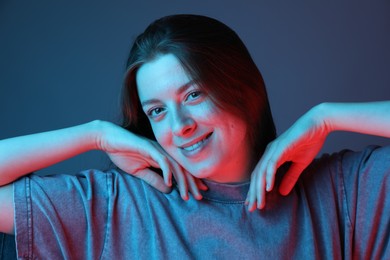 Photo of Portrait of beautiful young woman on color background