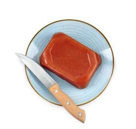 Photo of Delicious sweet quince paste and knife isolated on white, top view