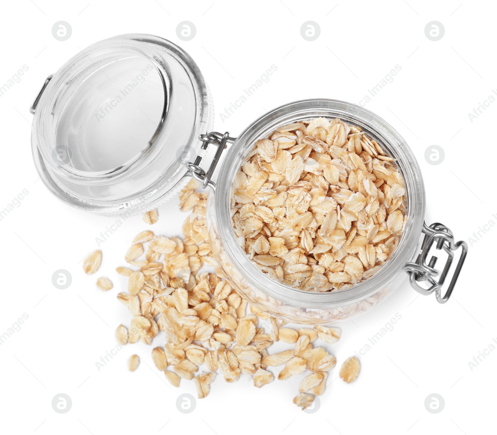 Photo of Raw oatmeal and glass jar on white background, top view