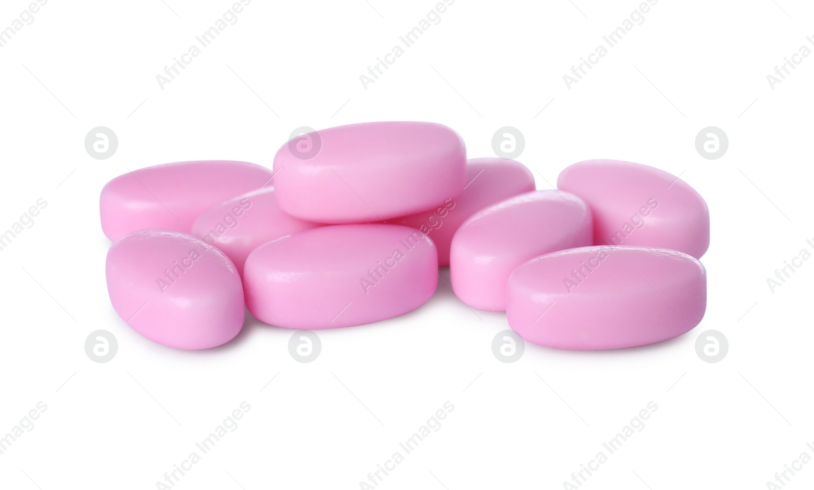 Photo of Tasty pink dragee candies on white background