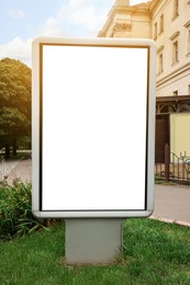Photo of Blank citylight poster outdoors. Mockup for design