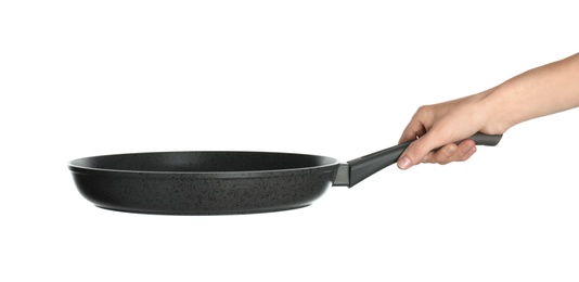 Woman holding new clean frying pan on white background