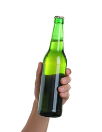 Man holding green bottle with beer on white background, closeup