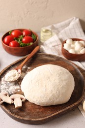 Photo of Pizza dough and products on gray table