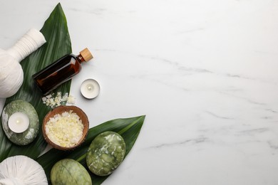 Photo of Flat lay composition with spa products .and candles on white marble table. Space for text