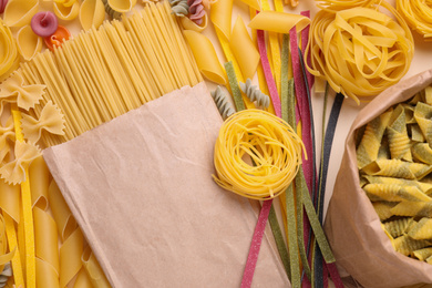 Photo of Different types of uncooked pasta , top view