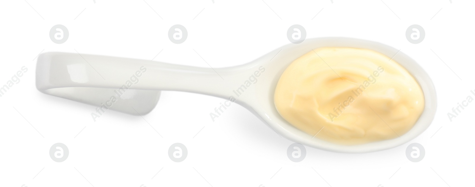 Photo of Mayonnaise in ceramic serving spoon isolated on white, top view