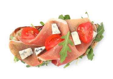 Tasty bruschetta with prosciutto, arugula, cheese and tomato on white background, top view