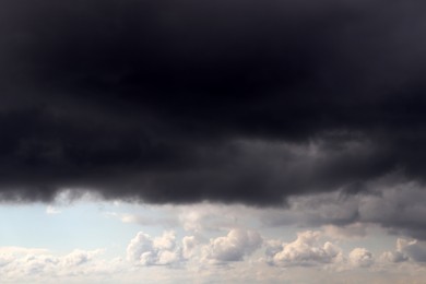 Photo of Sky with heavy rainy clouds on grey day