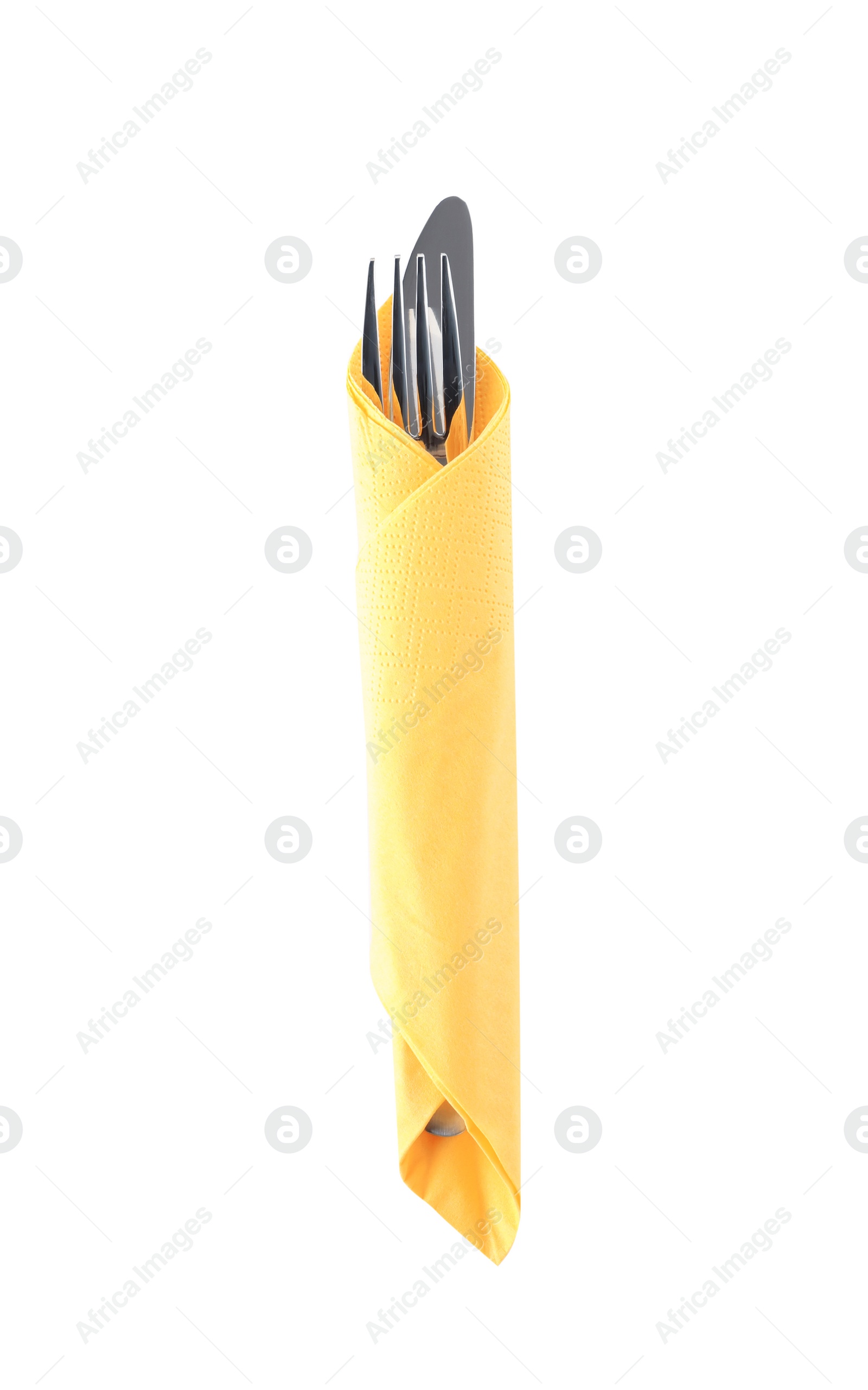 Photo of Cutlery wrapped in paper napkin on white background, top view