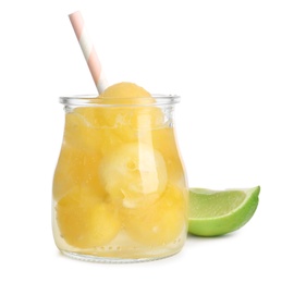 Photo of Glass jar of melon ball cocktail and lime on white background