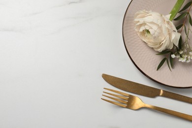 Photo of Stylish table setting with cutlery and flowers on white marble background, flat lay. Space for text