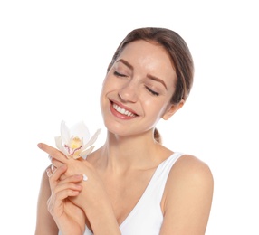 Photo of Young woman with flower applying hand cream on white background. Beauty and body care