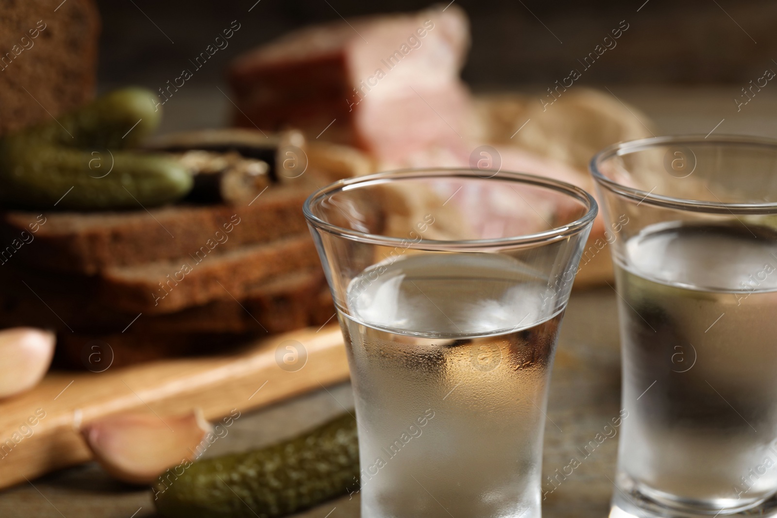 Photo of Cold traditional Russian vodka on table, closeup view