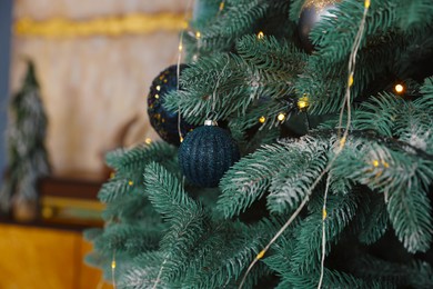 Beautiful Christmas tree with stylish decor indoors, closeup