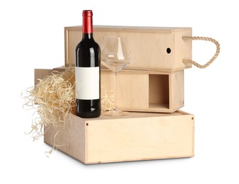 Wooden gift boxes with wine and glass isolated on white