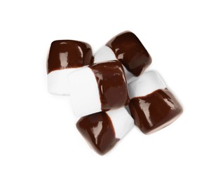 Photo of Tasty marshmallows dipped into chocolate on white background, top view