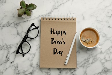 Image of Notebook with phrase Happy Boss`s Day, coffee, glasses and plant on marble table, flat lay
