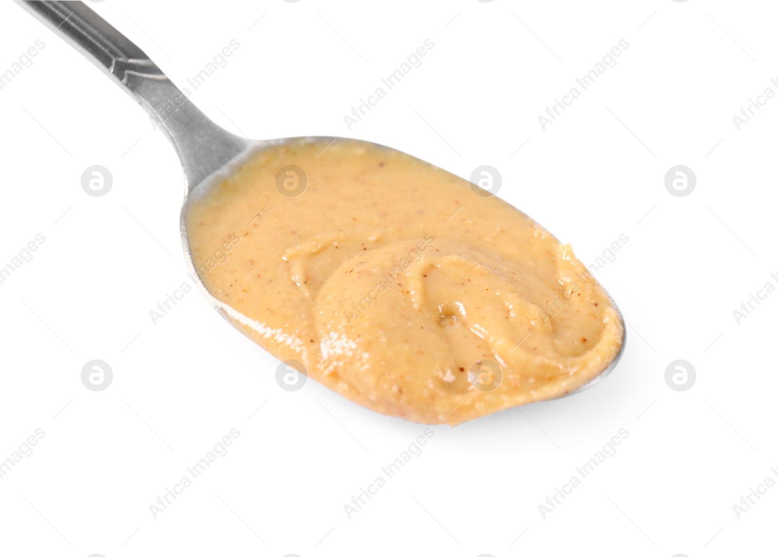 Photo of Delicious nut butter in spoon isolated on white