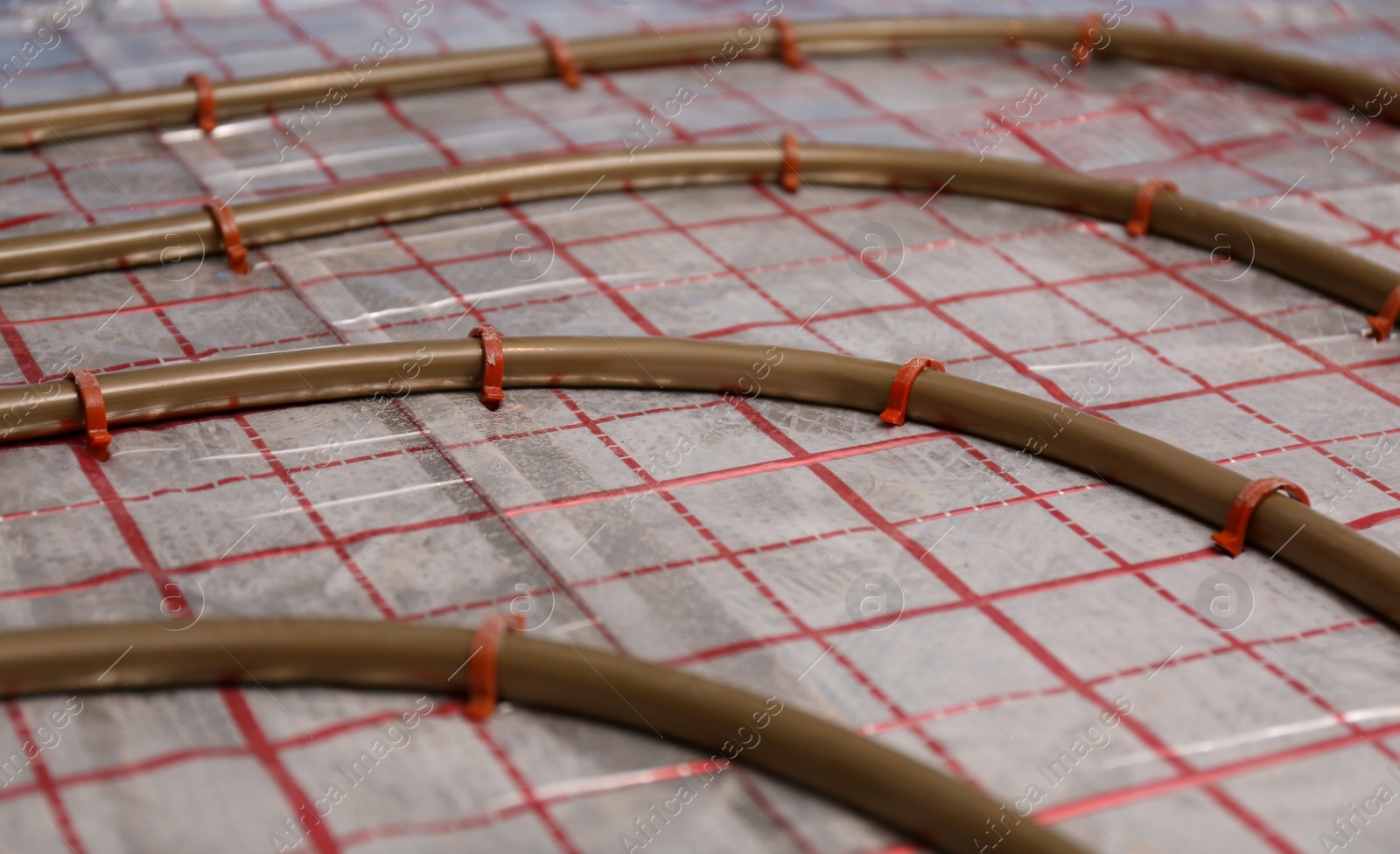 Photo of Installation of underfloor heating system in building