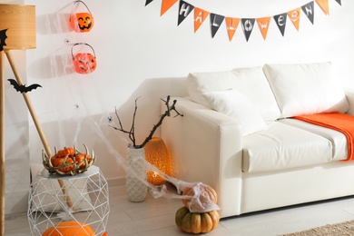 Photo of Modern room decorated for Halloween. Festive interior
