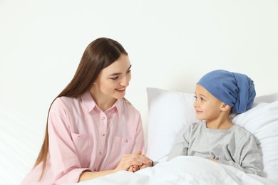Photo of Childhood cancer. Mother and daughter in hospital