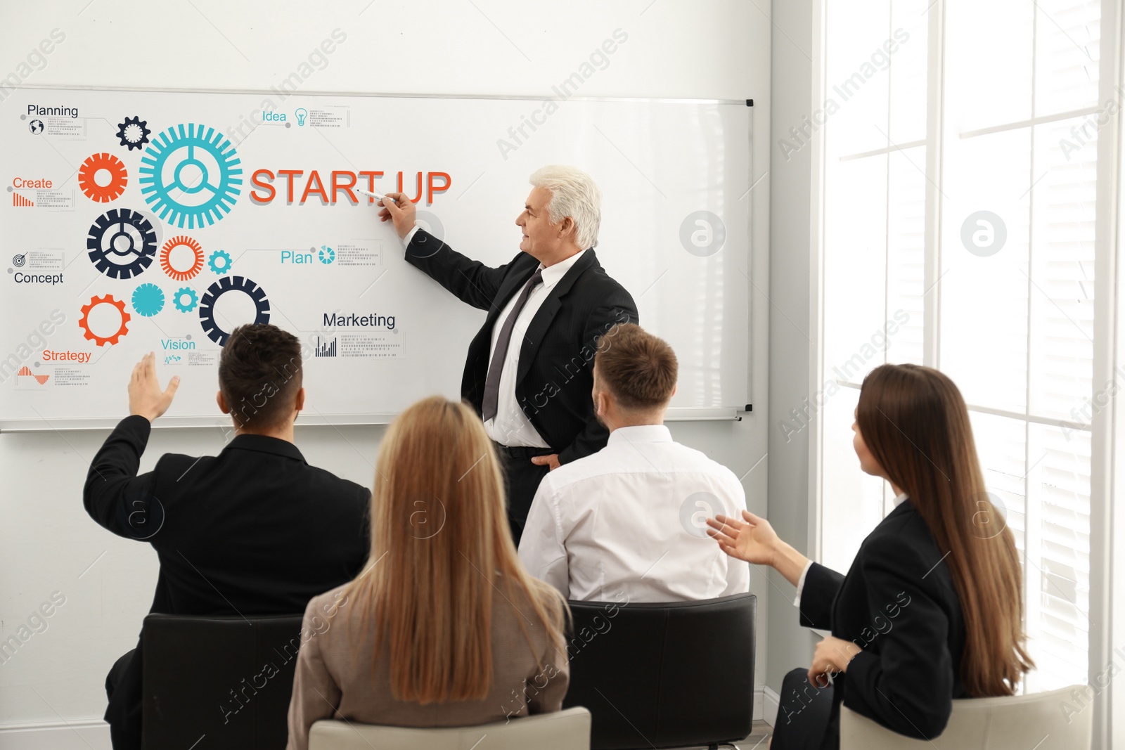Image of Business trainer giving lecture in conference room 