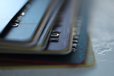 Photo of Plastic credit cards on table, macro view