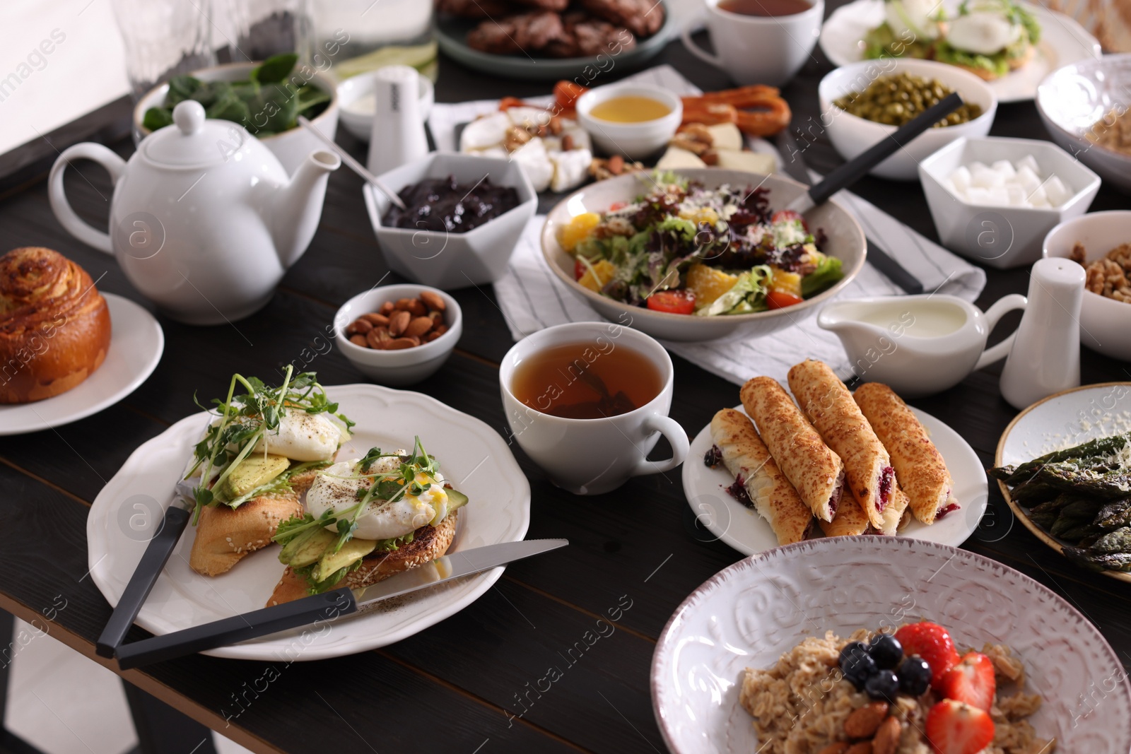 Photo of Many different dishes served on buffet table for brunch