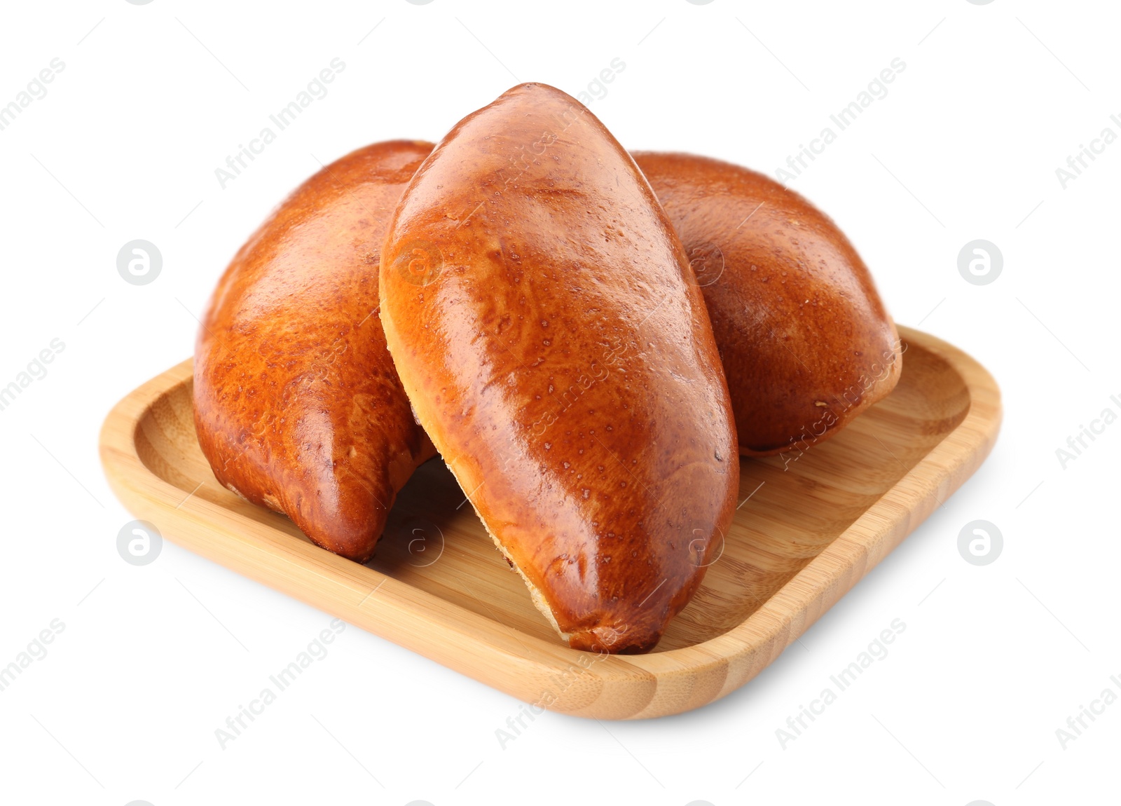 Photo of Wooden tray with delicious baked patties on white background