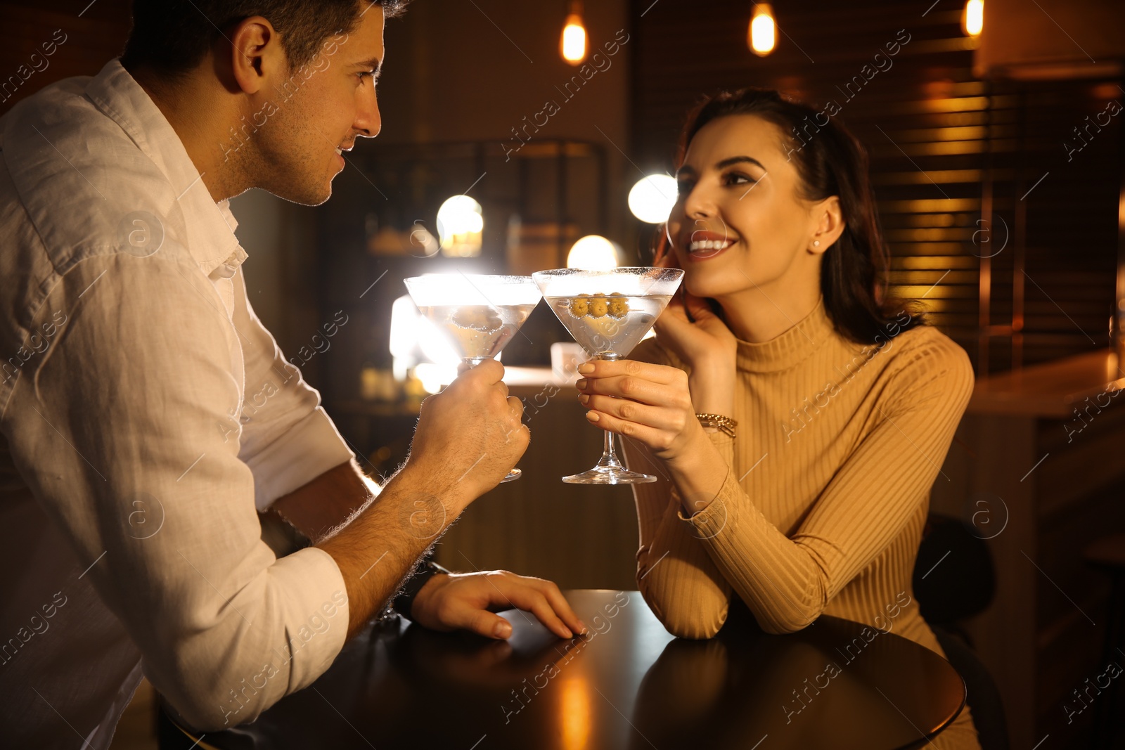 Photo of Man and woman flirting with each other in bar