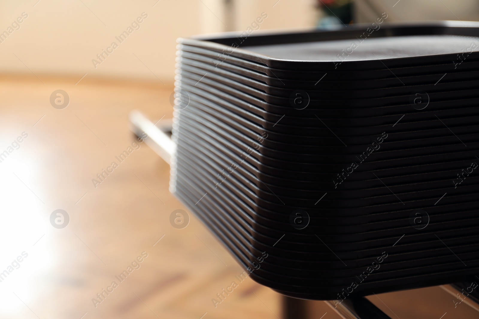 Photo of Stack of plastic trays for food in school canteen