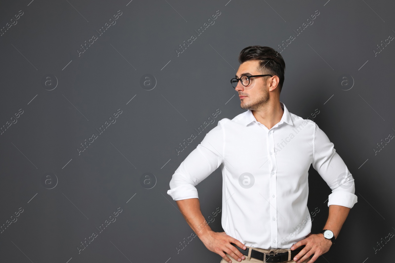 Photo of Portrait of handsome young man and space for text on black background