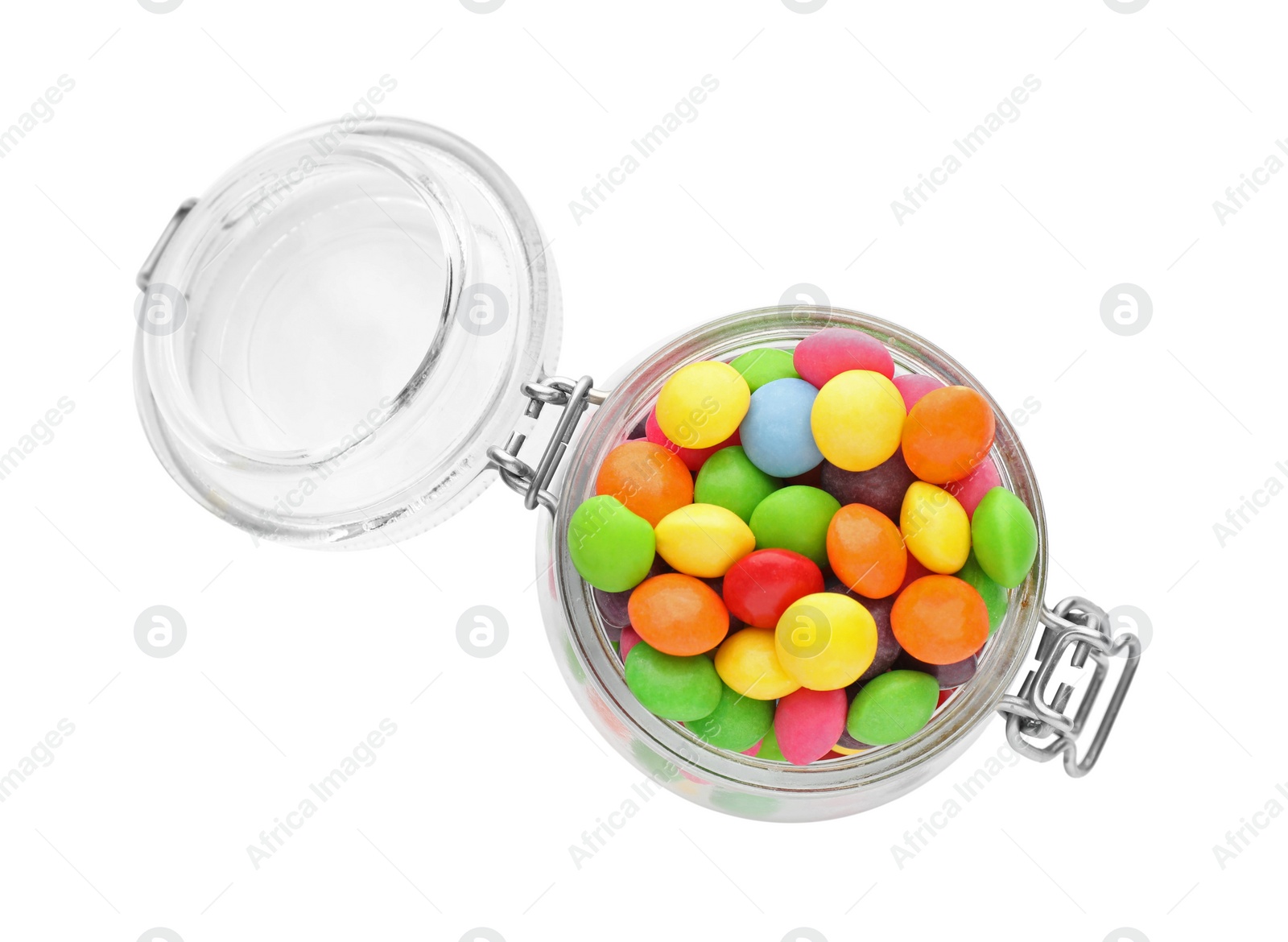 Photo of Many tasty candies in glass jar isolated on white, top view