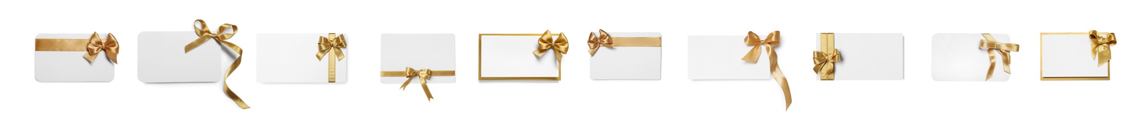 Set of many different gift cards with golden bows on white background, top view