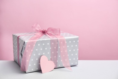 Photo of Elegant gift box for Mother's Day on table