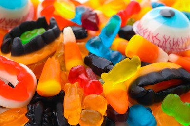 Delicious colorful candies as background, closeup. Halloween sweets